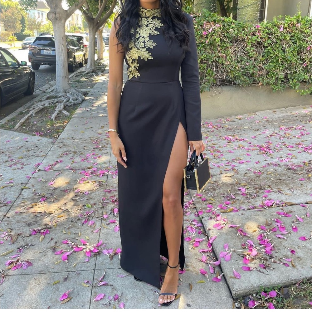 Black PLT one sleeve, high slit dress. With gold embroidery.